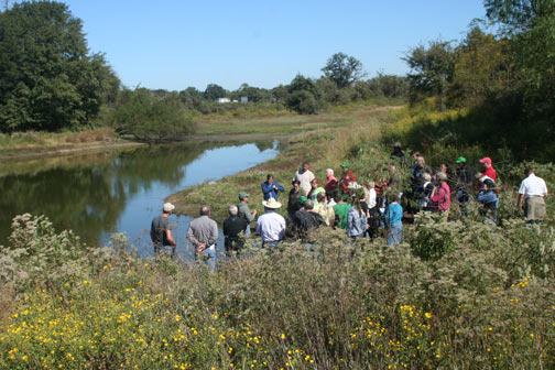 Ranch Management workshop participants gathering together in a field.